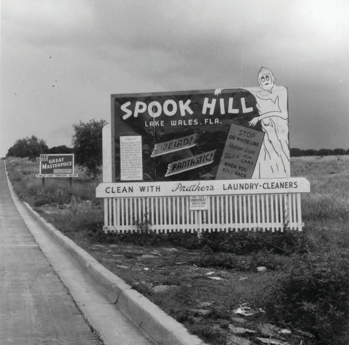 This photo from 1953 shows the sign that explained the Spook Hill phenomena.